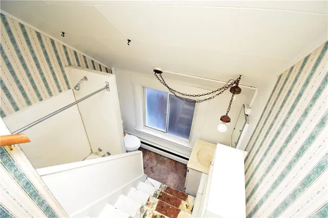 a bathroom with a sink a mirror and a bathtub