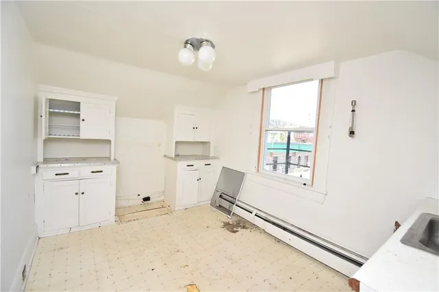 a room with a bed and a window