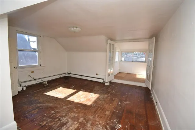 an empty room with a empty space and window