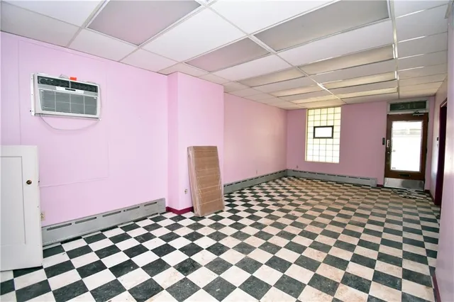 a bathroom with a black white checkered floor