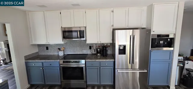 a dining room with furniture and a window