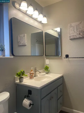 a view of a street with some trees in the background