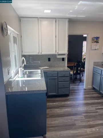 a kitchen with stainless steel appliances cabinets a sink and a counter space