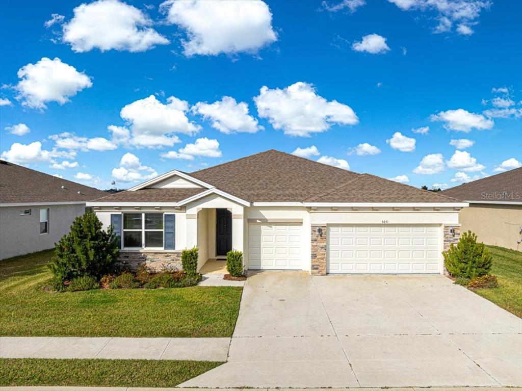 5851 Southwest 85th Place Ocala, FL 34476 - Photo 50 of 57 a view of a house with a yard