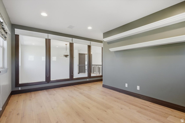 12317 Cypress Point Way Draper, UT 84020 - Photo 23 of 41 Light wood-finish flooring complements the neutral wall color in this versatile space