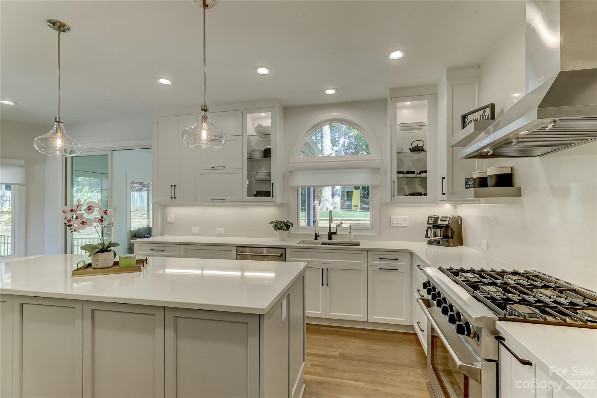4308 Rosecliff Drive Charlotte, NC 28277 - Photo 12 of 39 a kitchen with stainless steel appliances a sink stove and cabinets