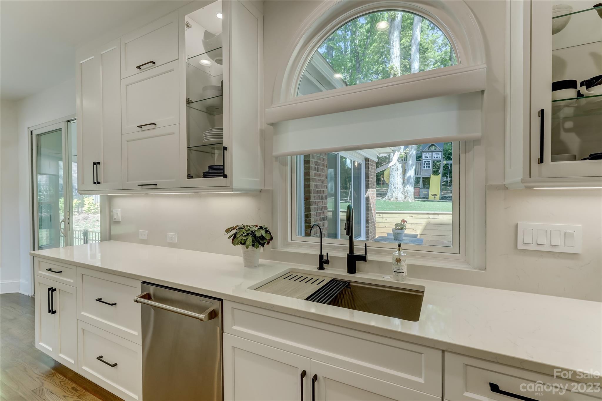 4308 Rosecliff Drive Charlotte, NC 28277 - Photo 14 of 39 a kitchen with a sink and large window