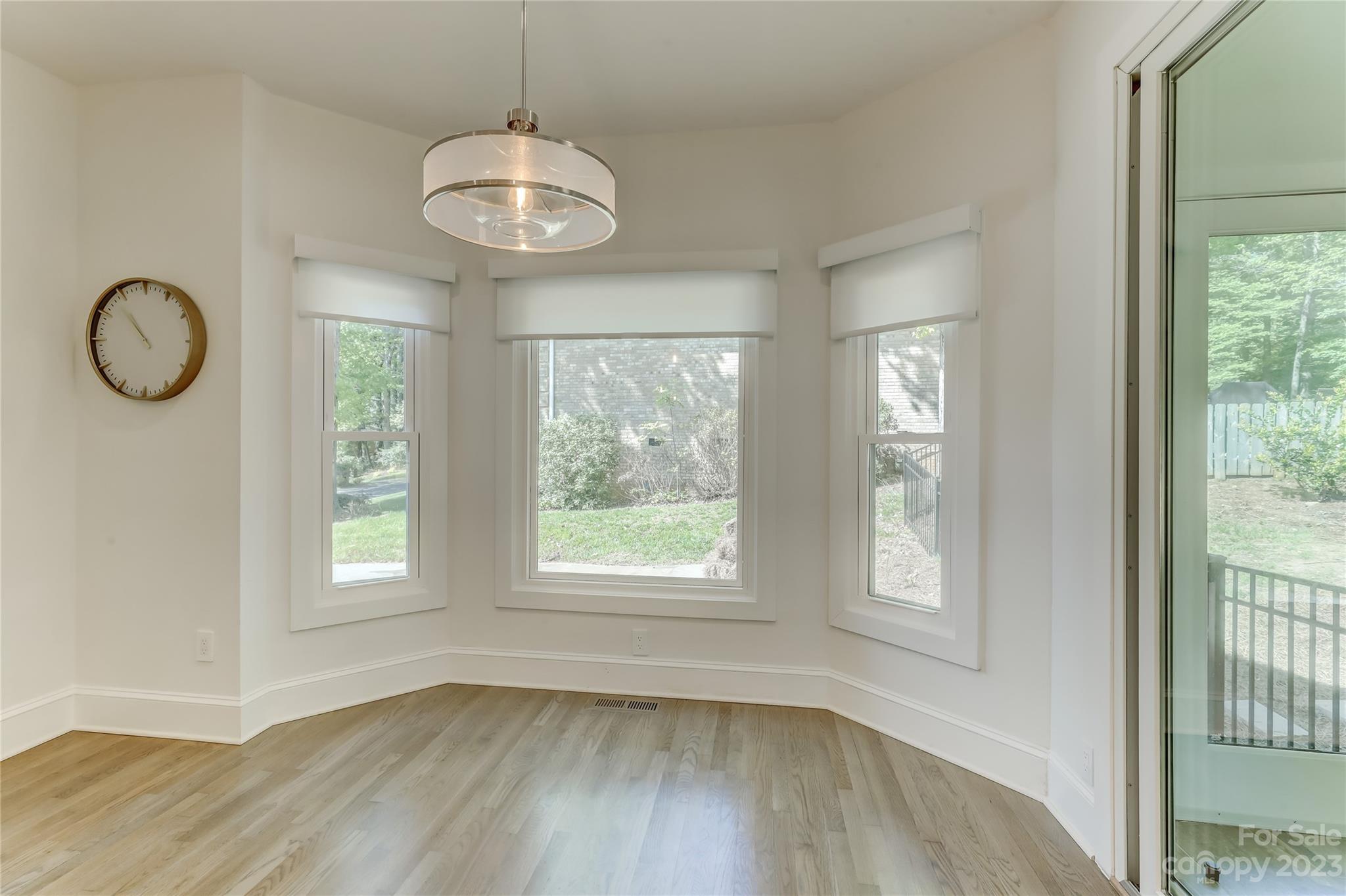 4308 Rosecliff Drive Charlotte, NC 28277 - Photo 16 of 39 a view of an empty room with wooden floor and window