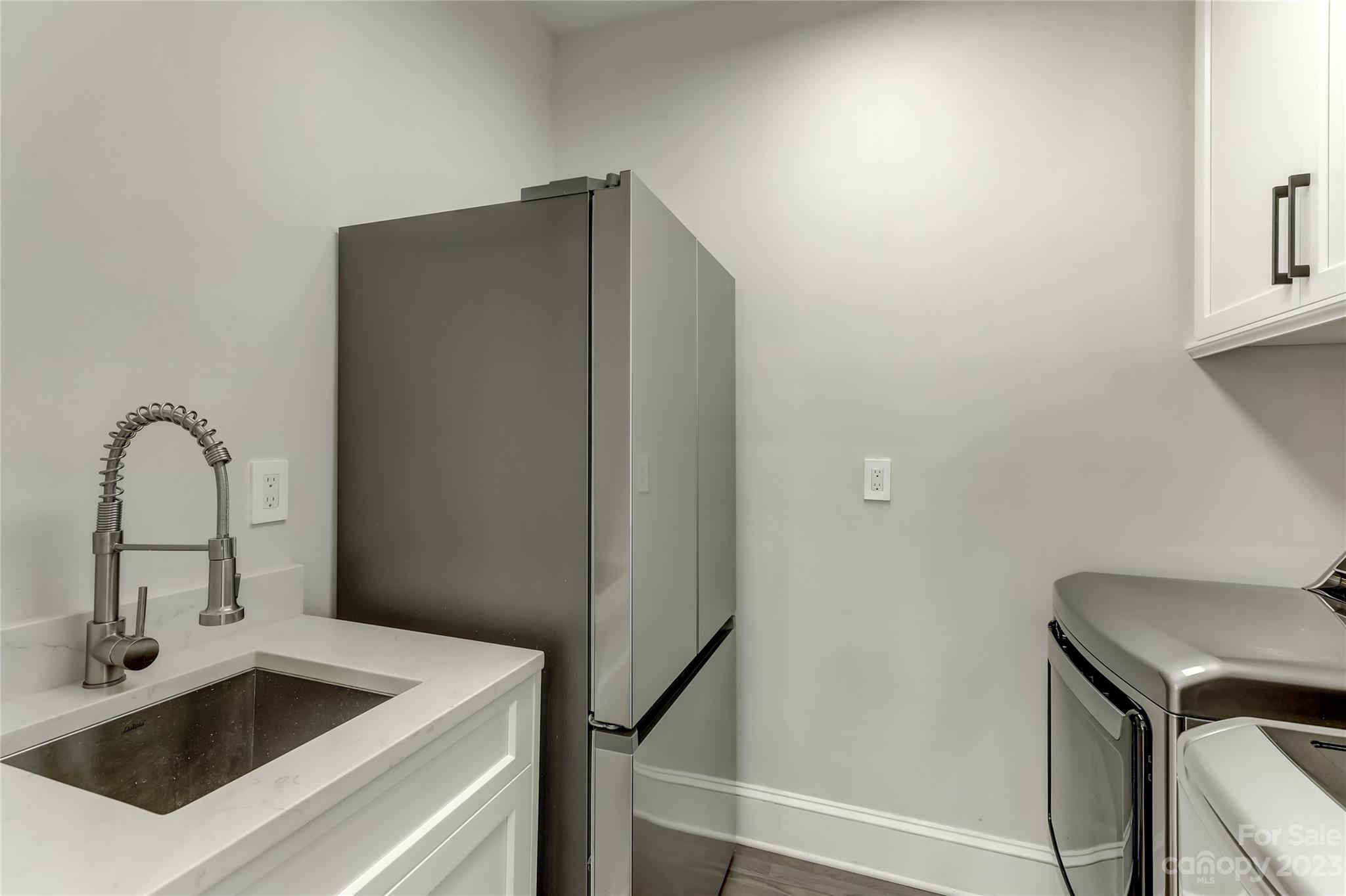 4308 Rosecliff Drive Charlotte, NC 28277 - Photo 19 of 39 a close view of a sink and dishwasher with cabinets