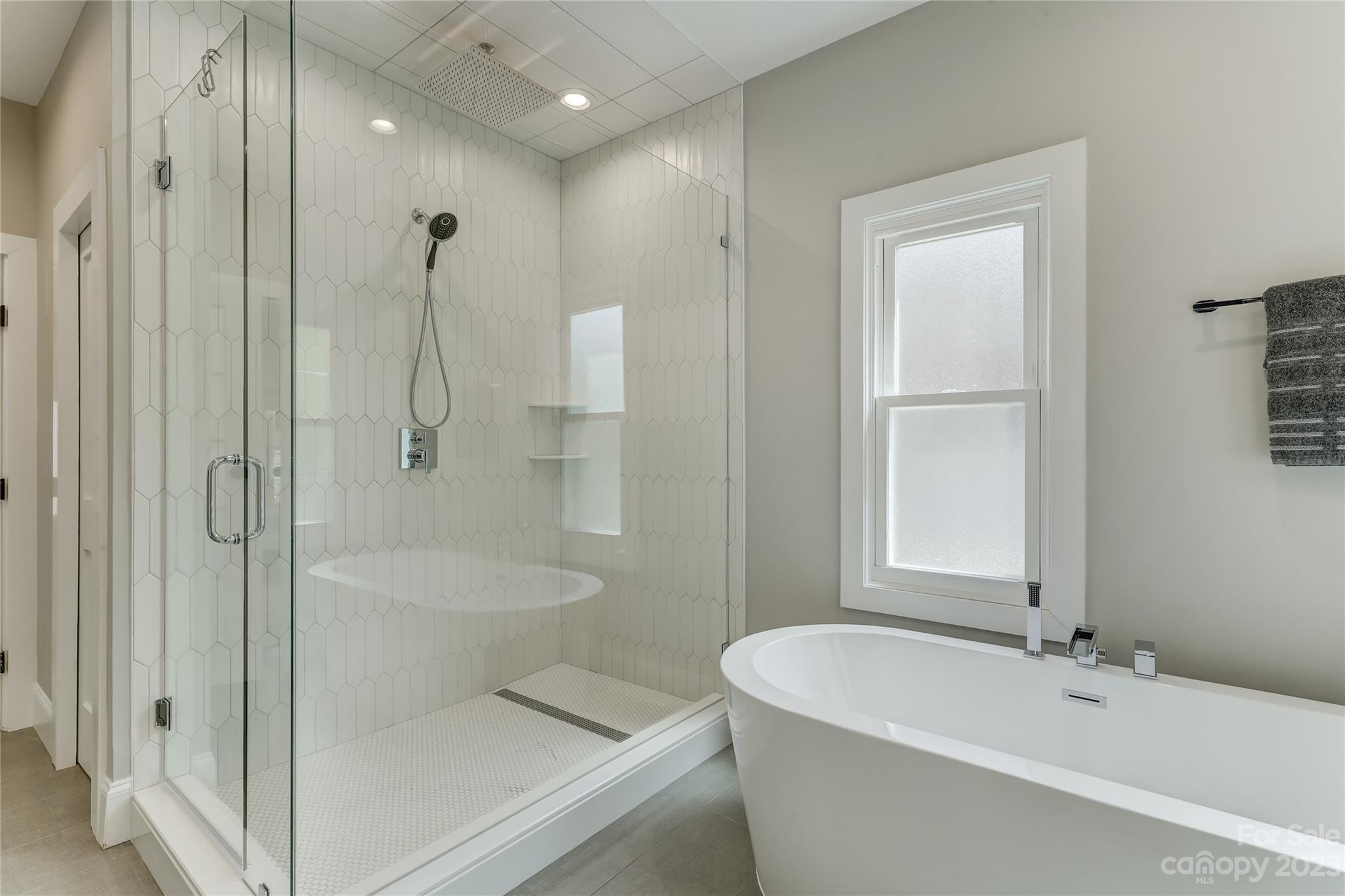 4308 Rosecliff Drive Charlotte, NC 28277 - Photo 25 of 39 a bathroom with a tub a toilet and a shower