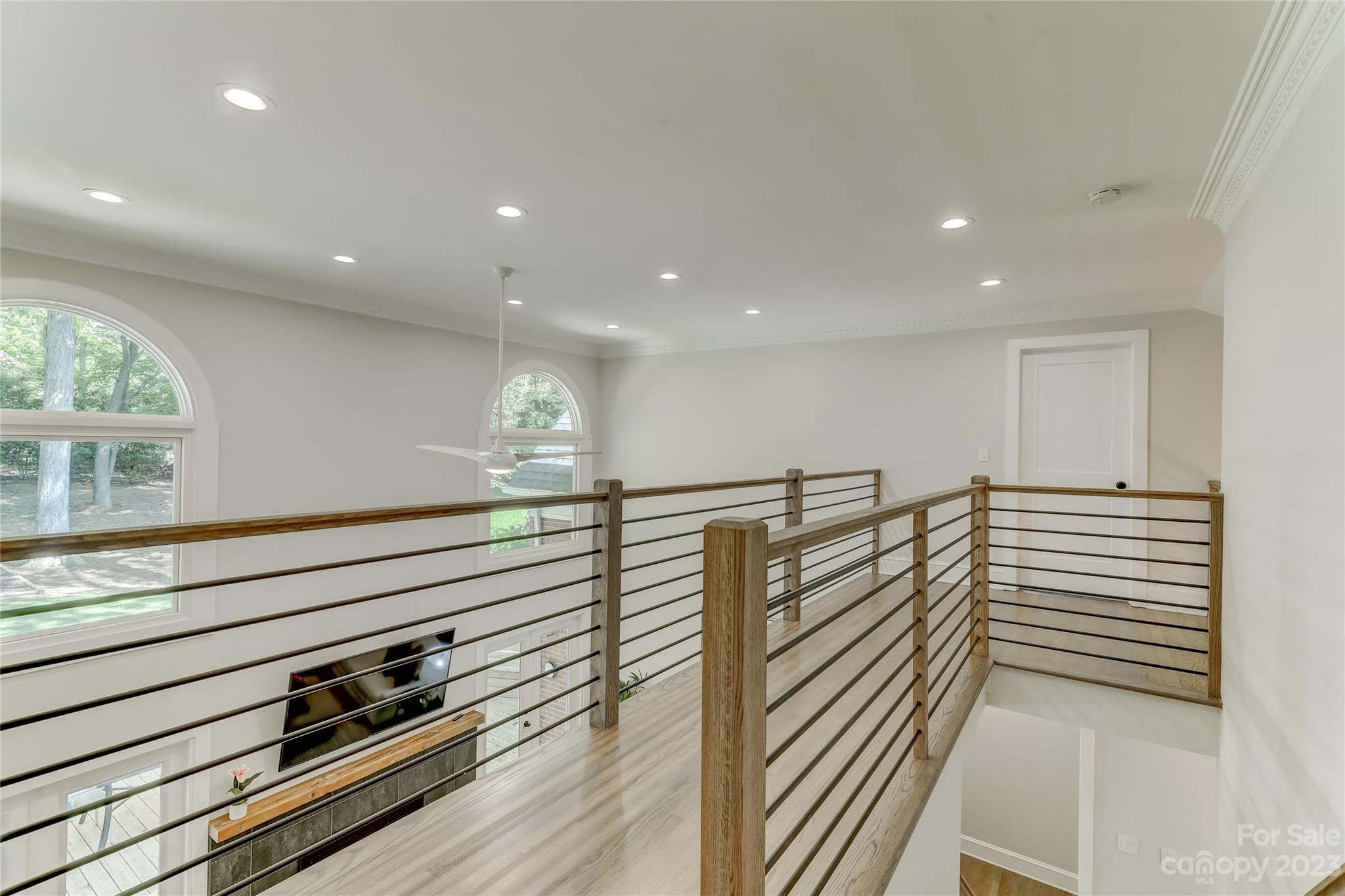 4308 Rosecliff Drive Charlotte, NC 28277 - Photo 26 of 39 a view of a hallway with stairs and wooden floor