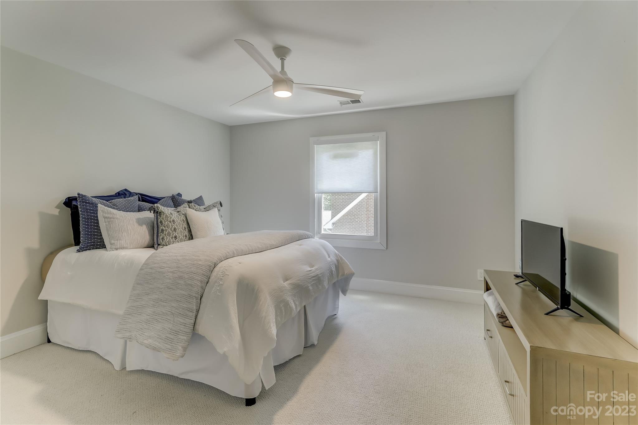 4308 Rosecliff Drive Charlotte, NC 28277 - Photo 28 of 39 a bedroom with a bed and a flat screen tv
