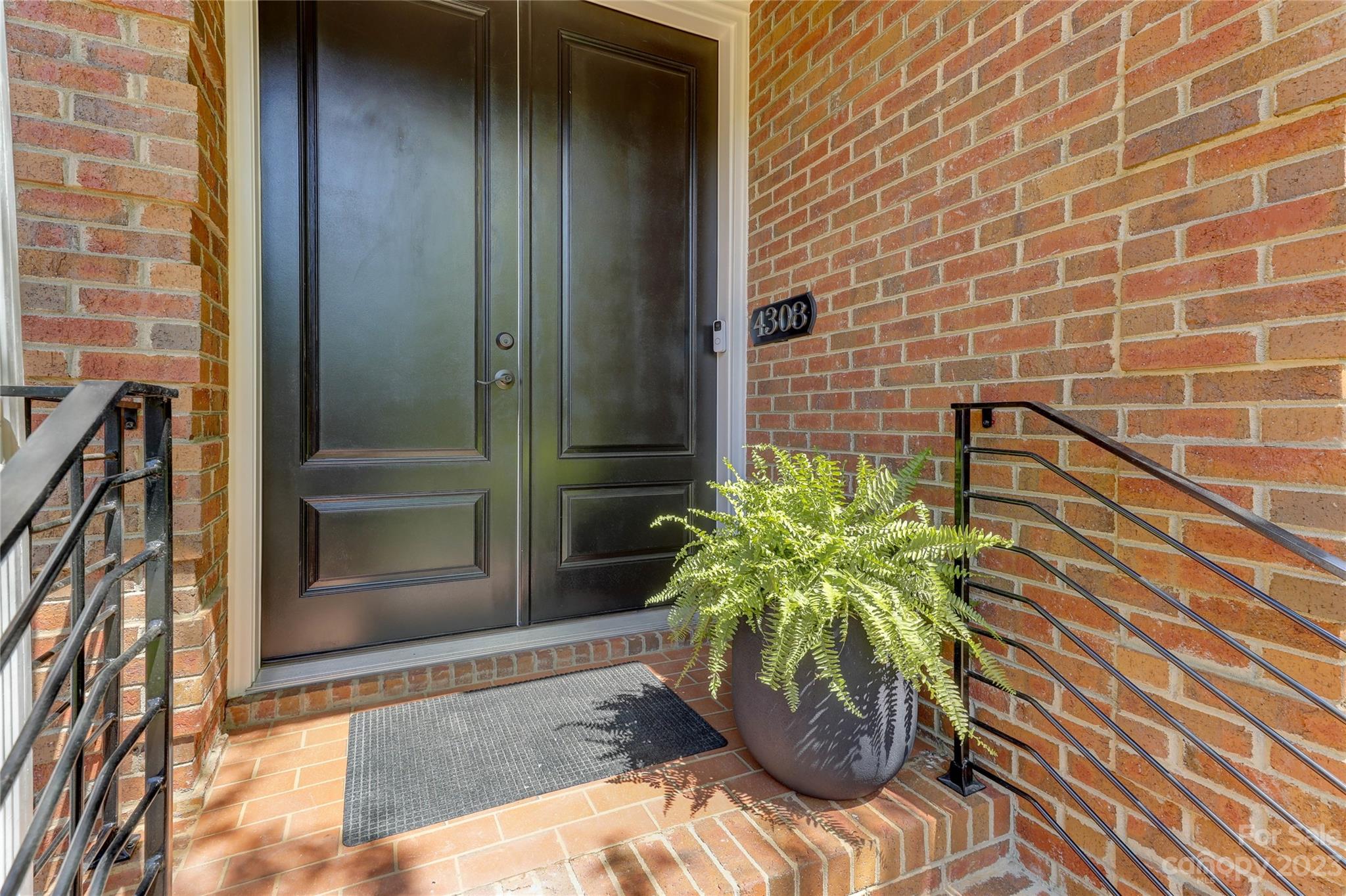 4308 Rosecliff Drive Charlotte, NC 28277 - Photo 3 of 39 a view of a potted plant in front of a door