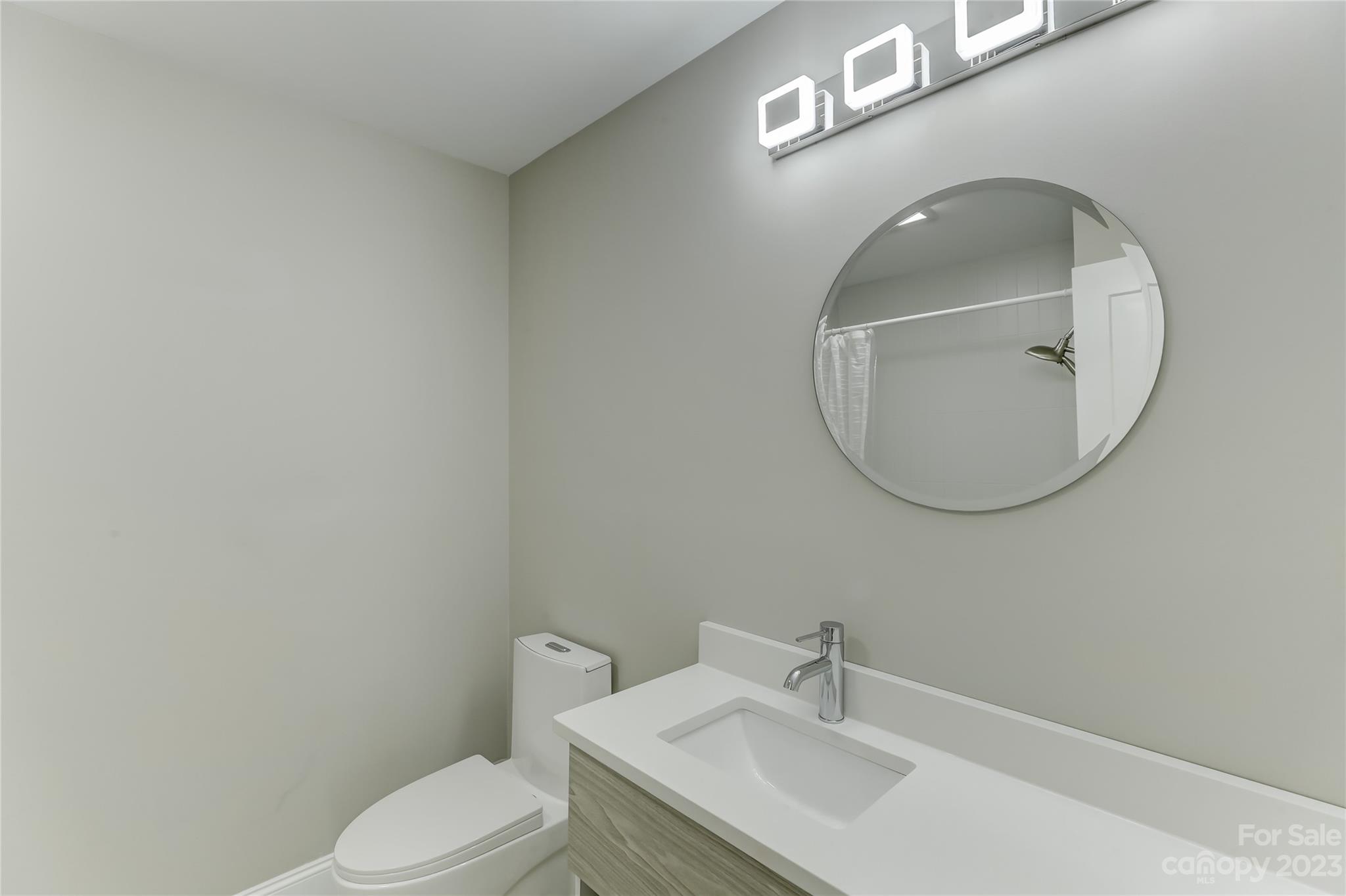4308 Rosecliff Drive Charlotte, NC 28277 - Photo 32 of 39 a bathroom with a sink a toilet and a mirror