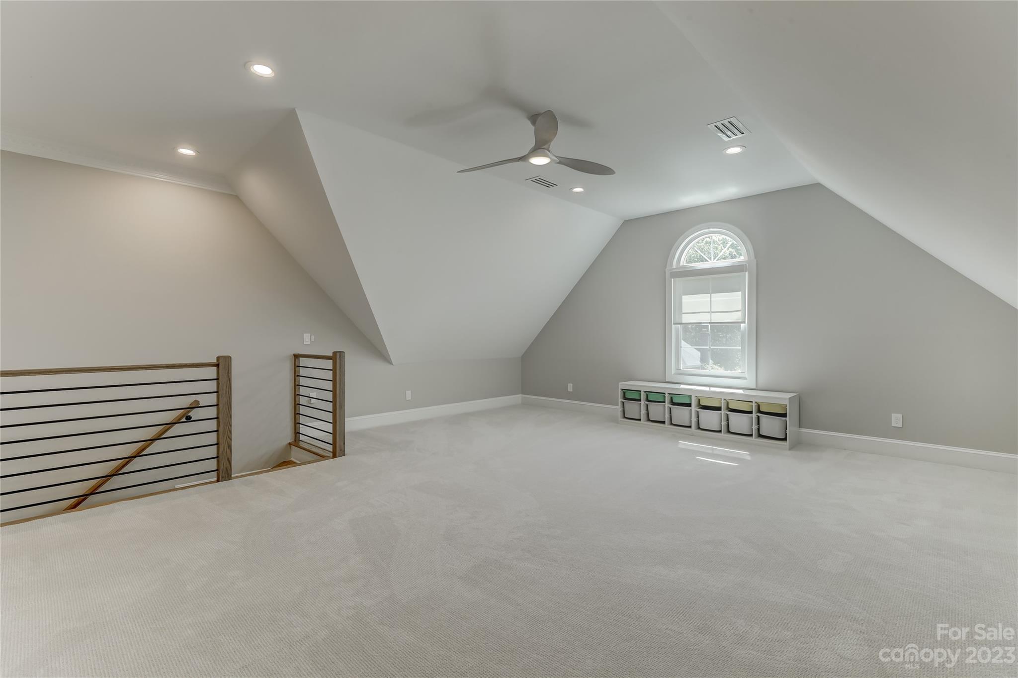 4308 Rosecliff Drive Charlotte, NC 28277 - Photo 34 of 39 an empty room with windows and ceiling fan