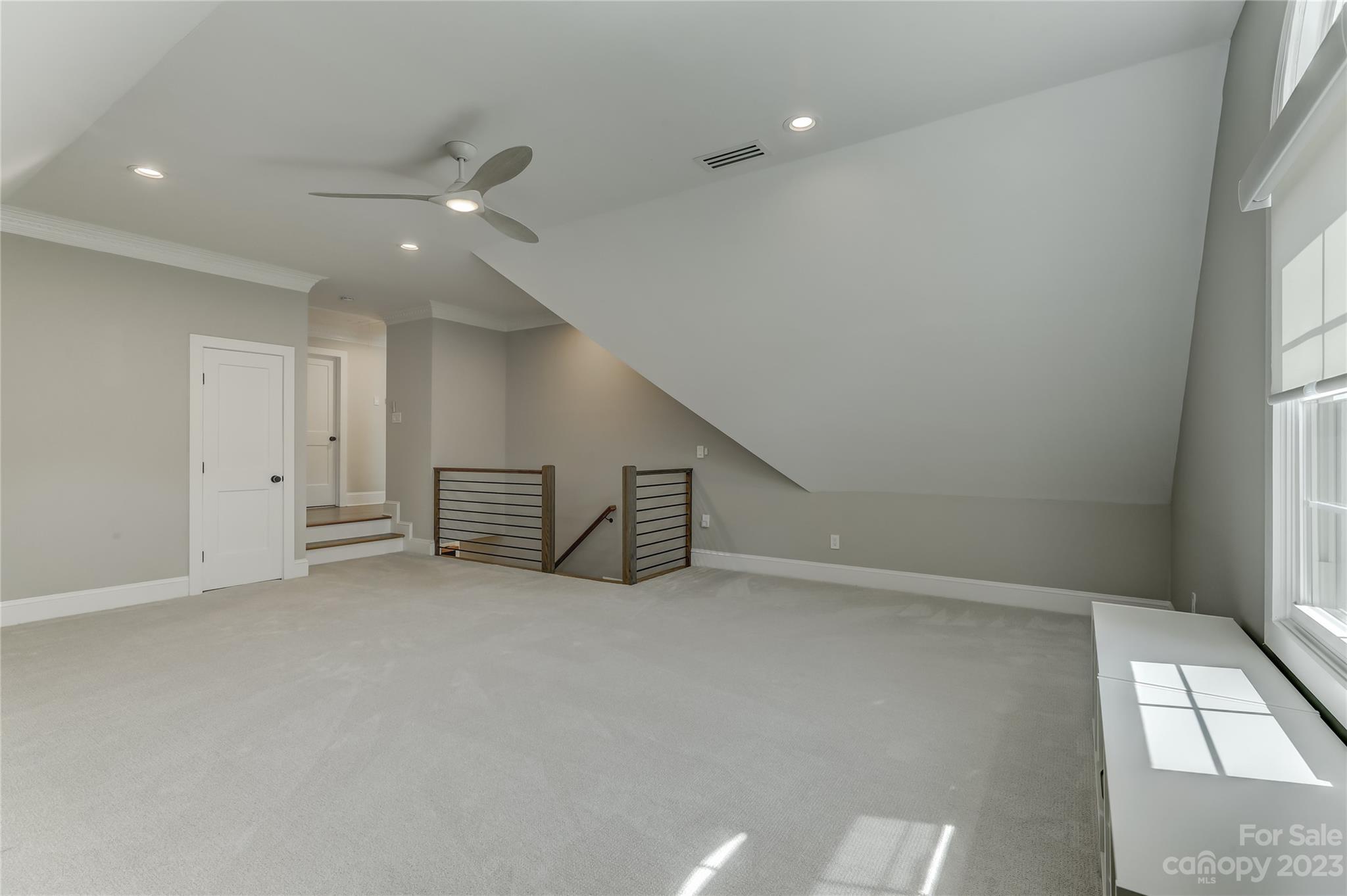 4308 Rosecliff Drive Charlotte, NC 28277 - Photo 35 of 39 an empty room with staircase and white walls