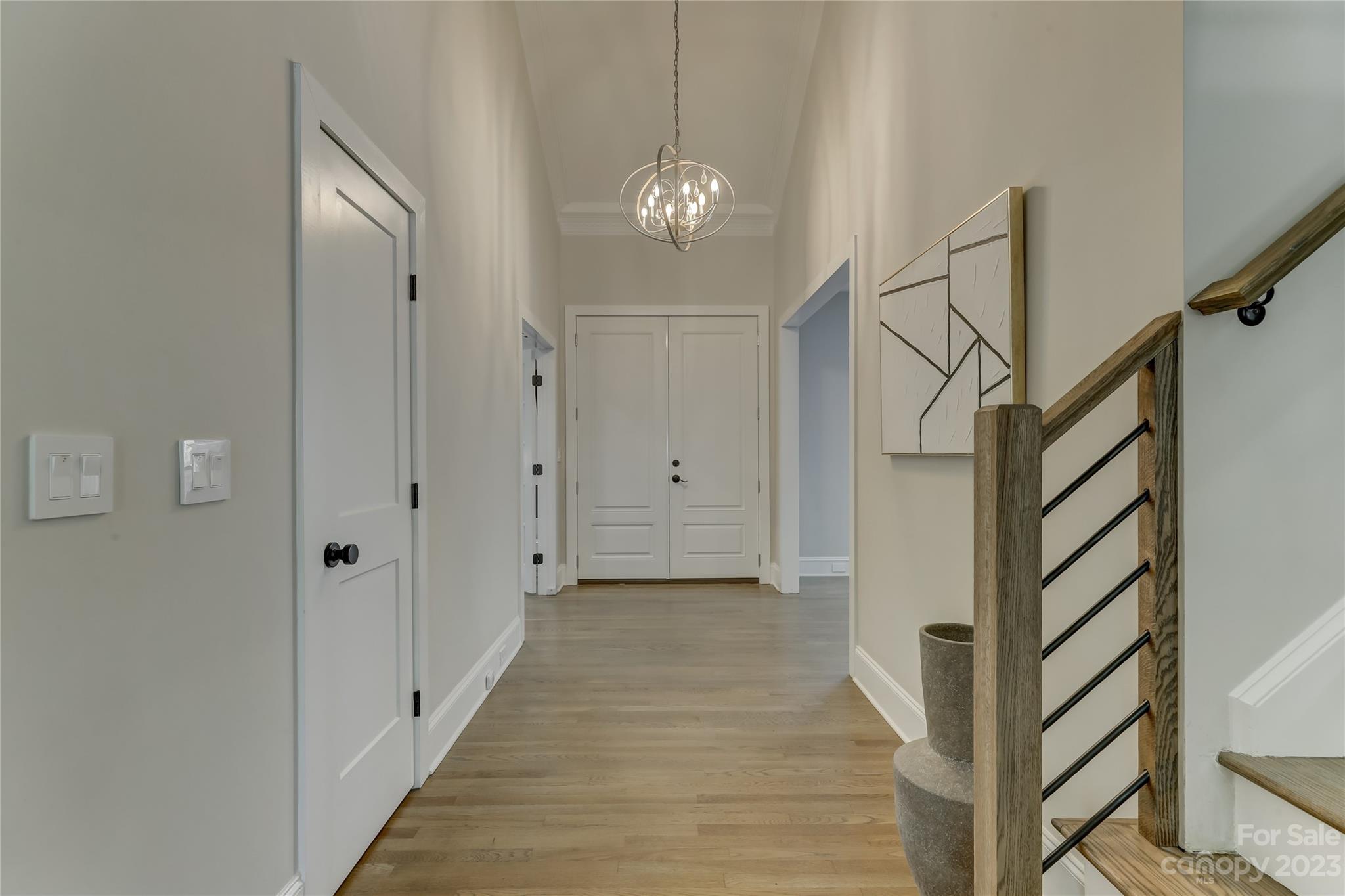 4308 Rosecliff Drive Charlotte, NC 28277 - Photo 4 of 39 a view of a hallway with wooden floor and staircase