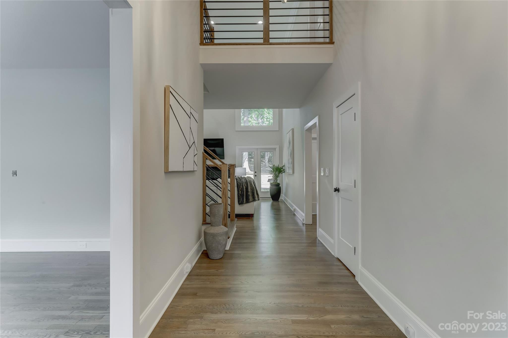 4308 Rosecliff Drive Charlotte, NC 28277 - Photo 5 of 39 a view of a hallway with wooden floor and stairs