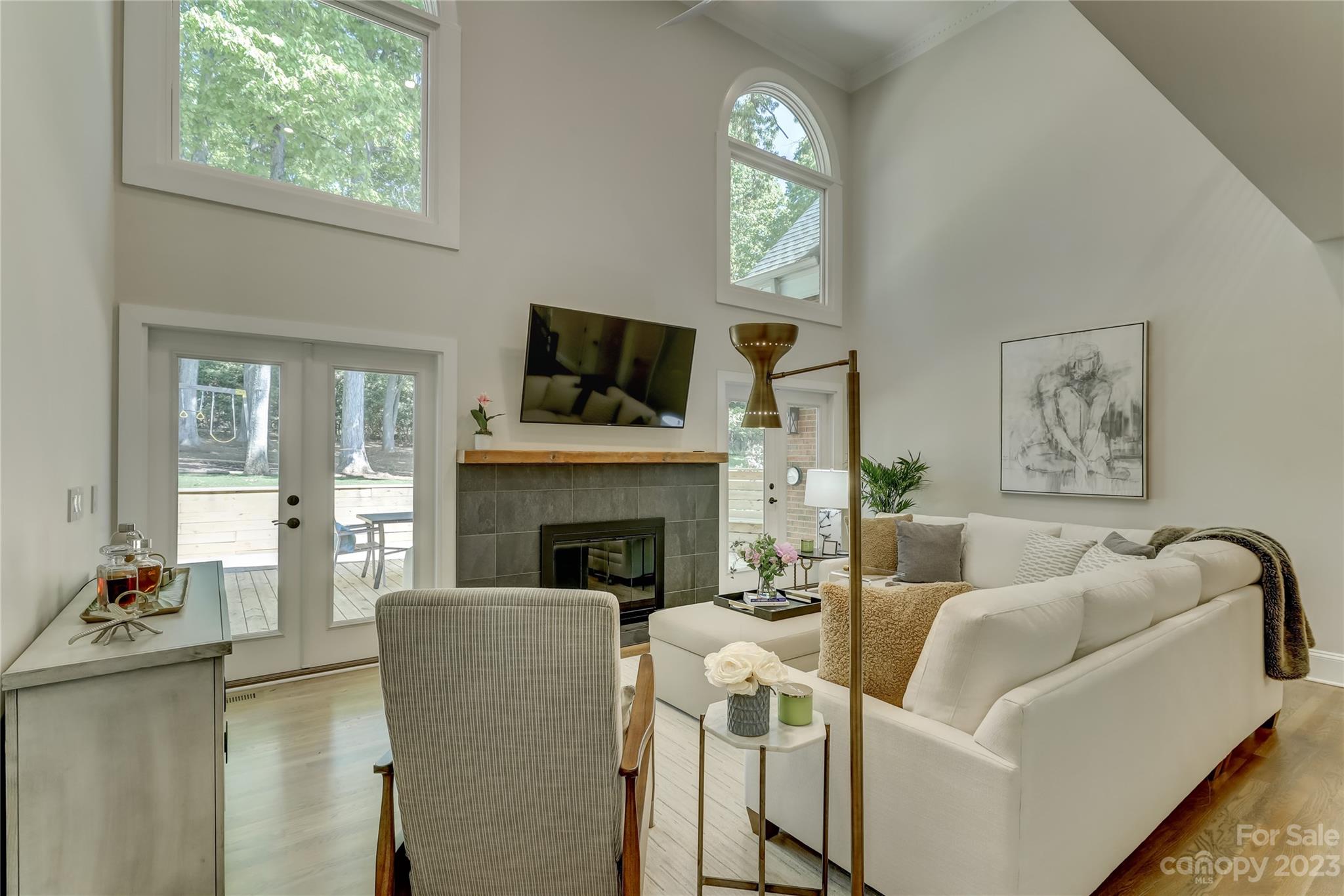 4308 Rosecliff Drive Charlotte, NC 28277 - Photo 10 of 39 a living room with furniture a fireplace and a flat screen tv