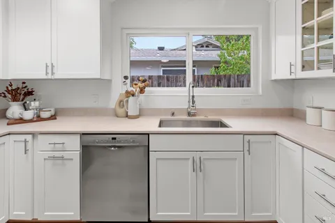 a kitchen with a sink and refrigerator