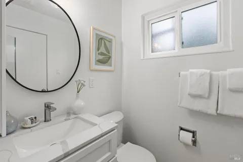 a bedroom with a bed and a table in it