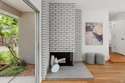 a living room with furniture and a lamp