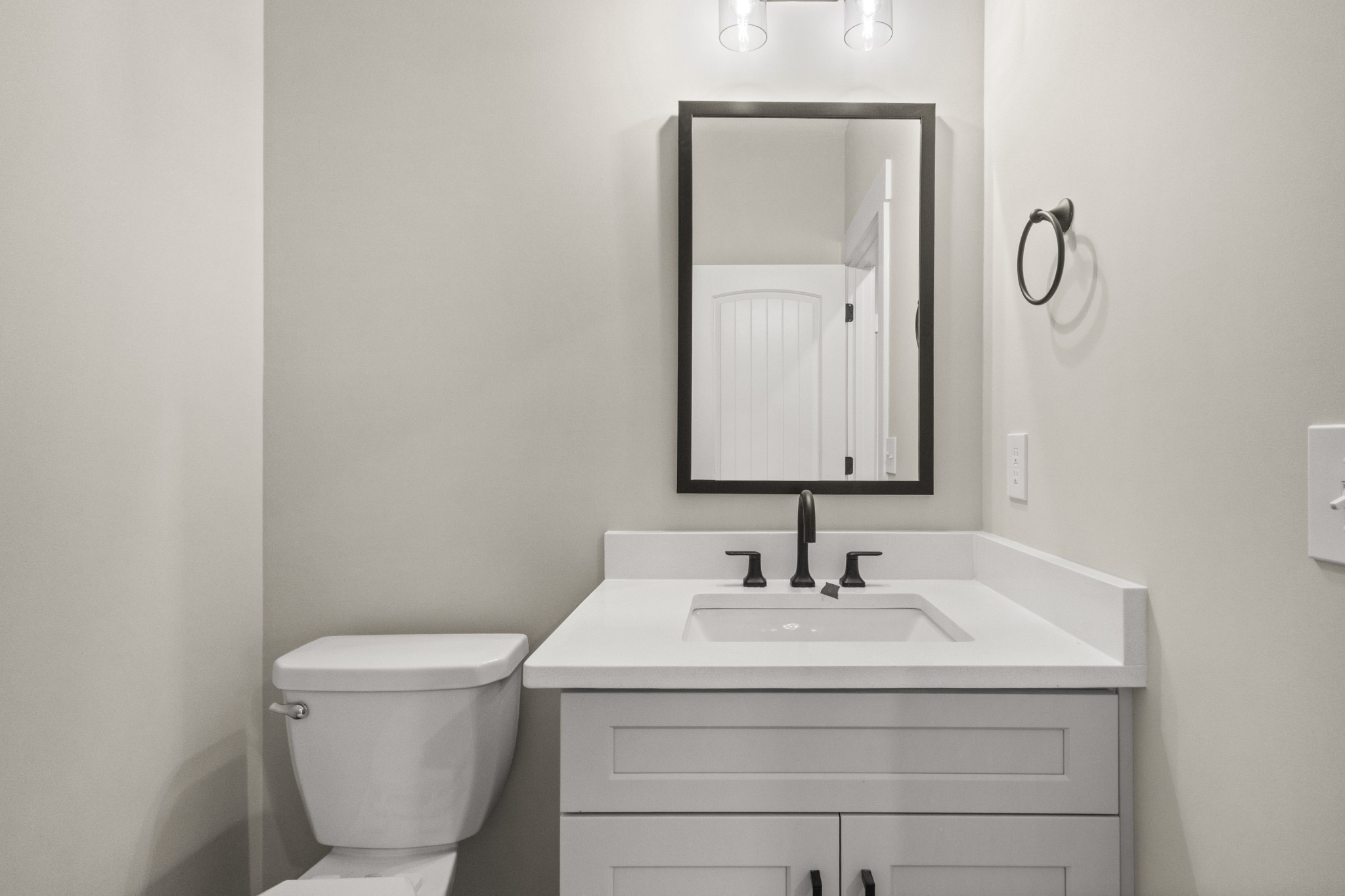 1169 Black Rock Road Clarksville, TN 37040 - Photo 19 of 40 a bathroom with a toilet sink and mirror