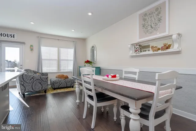 a view of a livingroom with furniture and a large window