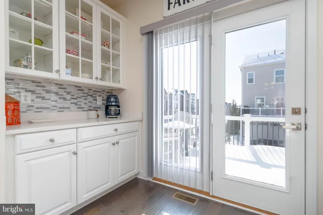 a view of a kitchen that has a large window