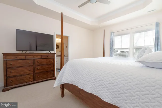 a living room with furniture and flat screen tv