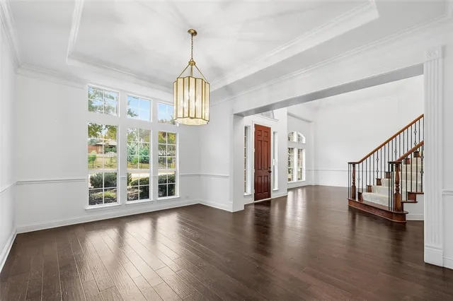 a view of an entryway with wooden floor