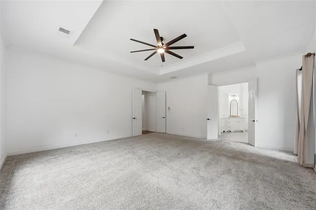 a living room with furniture a fireplace and potted plants