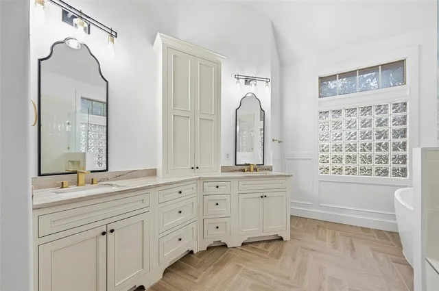 an empty room with fan and fireplace