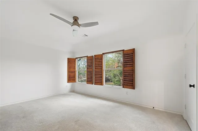 a spacious bathroom with double sink a a mirror a vanity and a shower