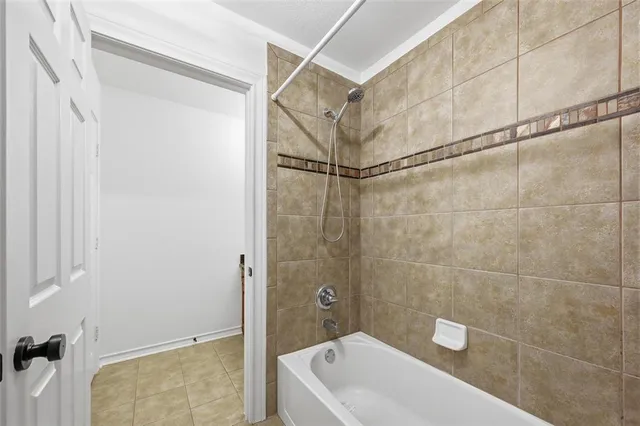 an aerial view of residential houses with outdoor space and lake view