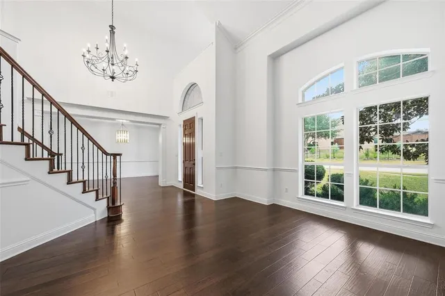 a view of a porch with furniture and a backyard