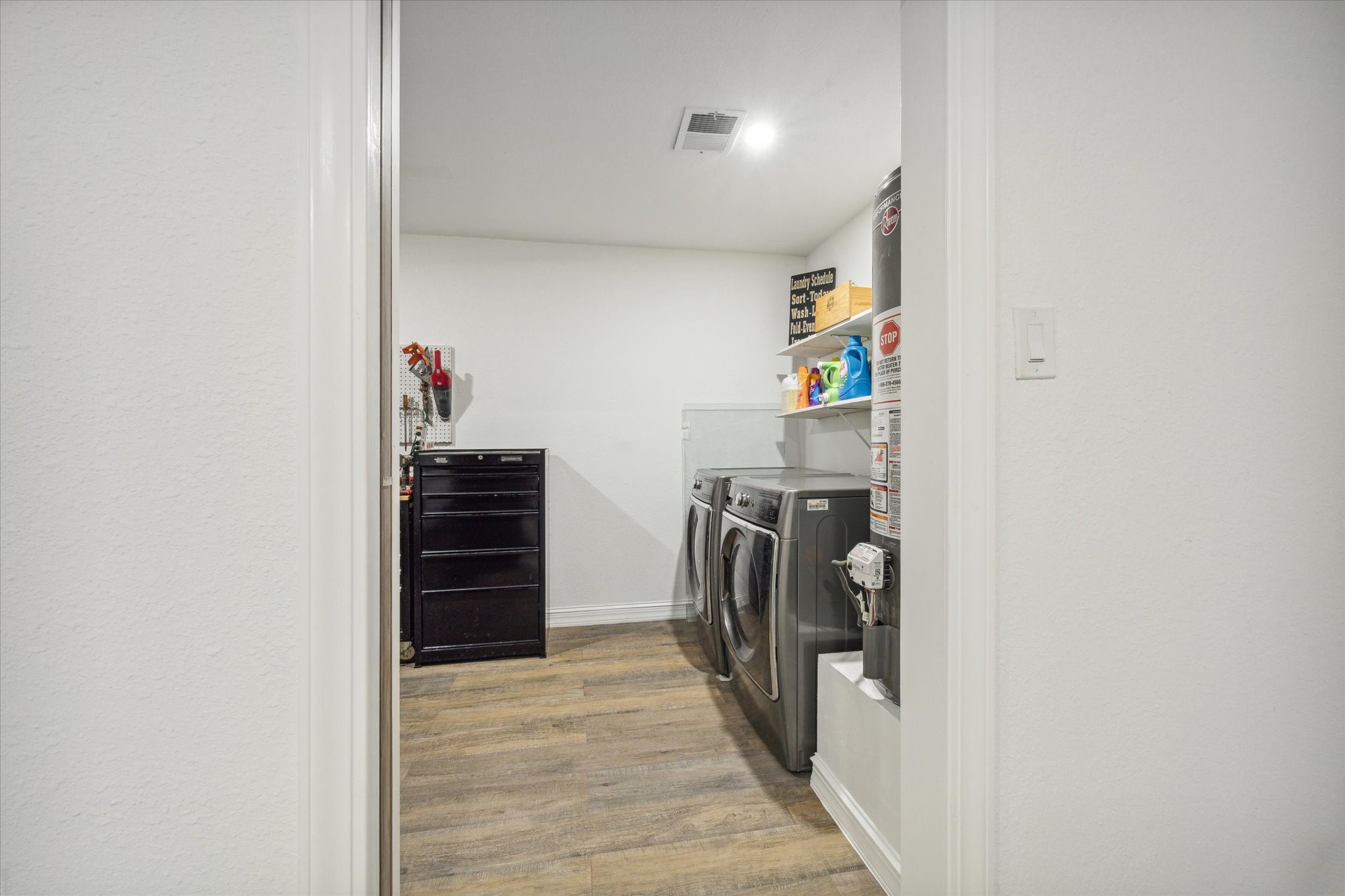 5 Tree Frog Drive Houston, TX 77074 - Photo 24 of 35 a view of a storage & utility room with a washer and dryer