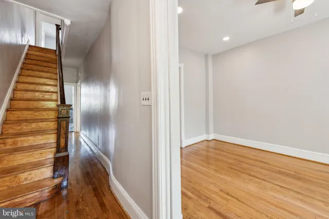 a livingroom with workspace and a couch