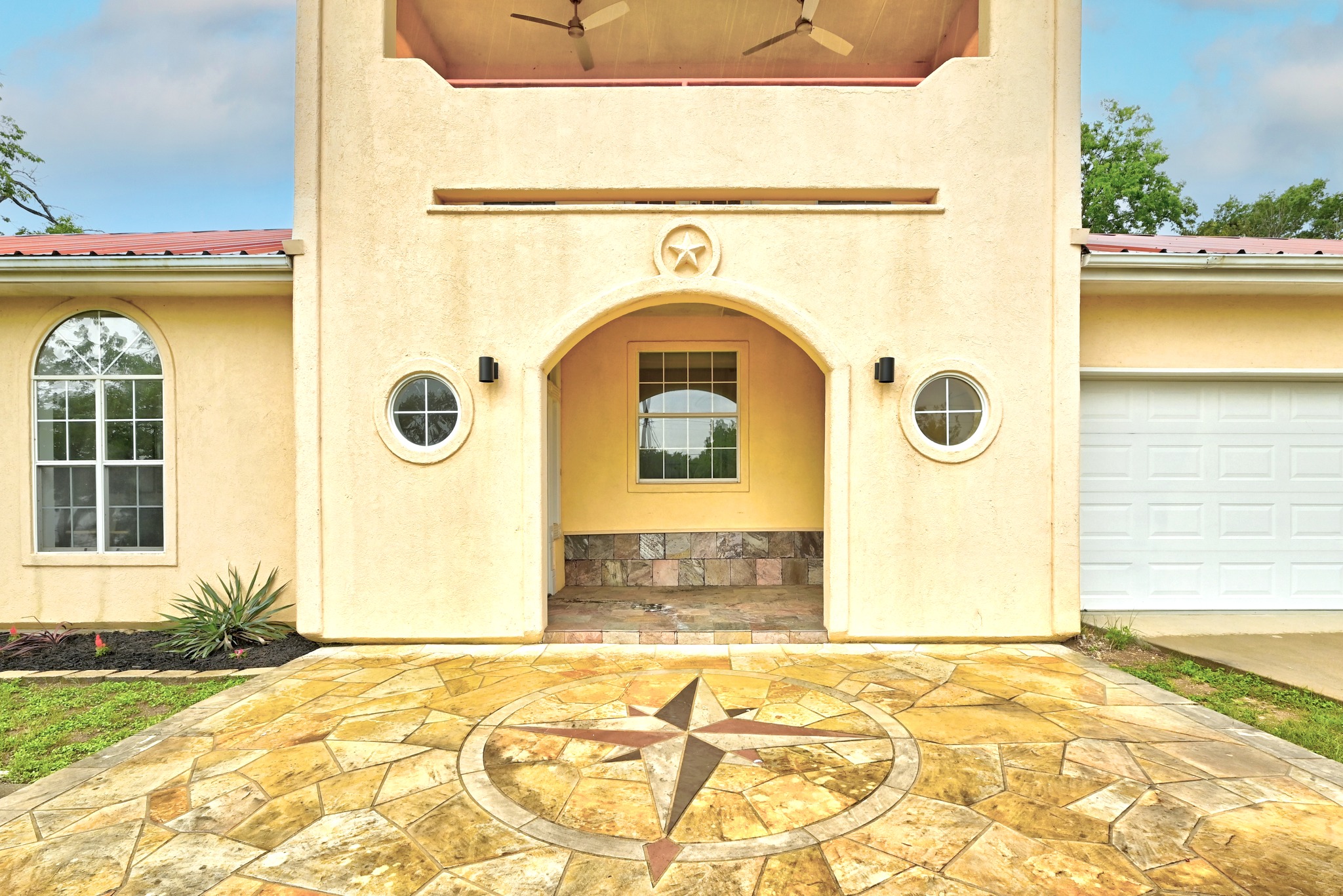 2405 Bahama Road Austin, TX 78733 - Photo 6 of 39 a front view of a house with a yard
