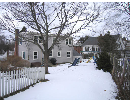 320 Appleton Street Arlington, MA 02476 - Photo 13 of 14 a street view covered with snow in front of house