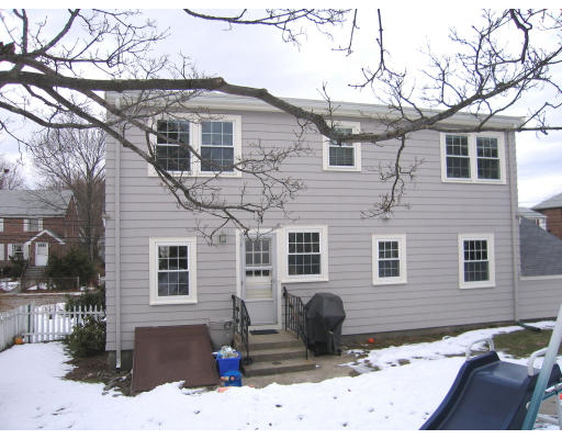 320 Appleton Street Arlington, MA 02476 - Photo 14 of 14 a front view of a house with a yard covered in snow