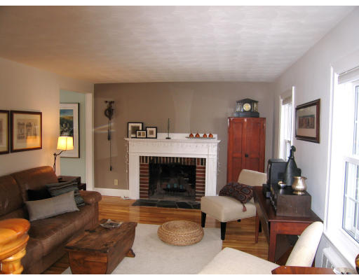 320 Appleton Street Arlington, MA 02476 - Photo 2 of 14 a living room with furniture and a fireplace