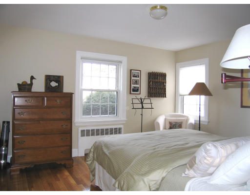 320 Appleton Street Arlington, MA 02476 - Photo 8 of 14 a bedroom with a bed and a window