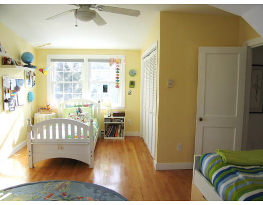 320 Appleton Street Arlington, MA 02476 - Photo 9 of 14 a bedroom with a bed and a table
