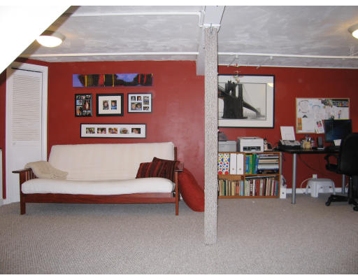 320 Appleton Street Arlington, MA 02476 - Photo 10 of 14 a living room with furniture and a book shelf