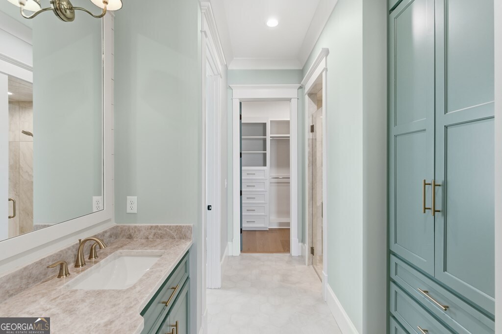 5909 Travis Trail Lake Park, GA 31636 - Photo 14 of 46 a bathroom with a granite countertop sink and a mirror