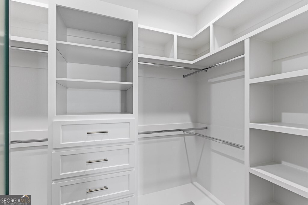 5909 Travis Trail Lake Park, GA 31636 - Photo 16 of 46 a view of walk in closet with empty racks