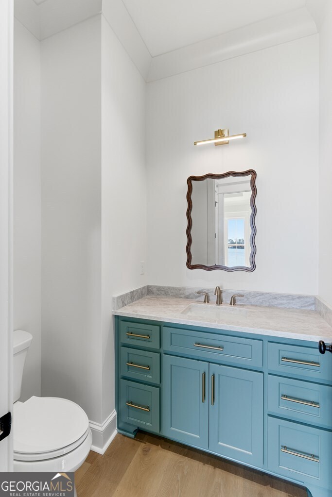 5909 Travis Trail Lake Park, GA 31636 - Photo 17 of 46 a bathroom with a toilet sink and mirror