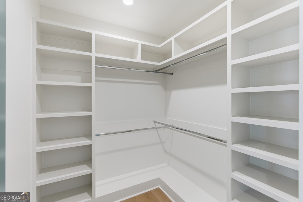 5909 Travis Trail Lake Park, GA 31636 - Photo 22 of 46 a view of walk in closet with empty racks