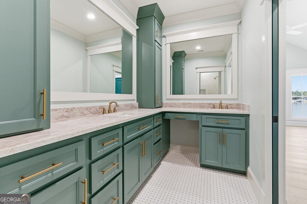 5909 Travis Trail Lake Park, GA 31636 - Photo 26 of 46 a bathroom with a double vanity sink and a mirror